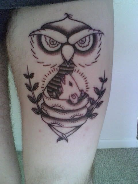 Getting tattooed as I type this. It's a "snowl," a snake/owl. it's a snake 